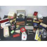 An assortment of shaving equipment including safety razors, Rolls razors, electric shavers,
