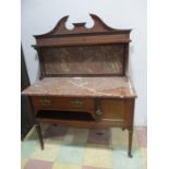 An inlaid marble topped wash stand