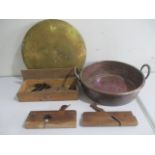 A large two handled copper pan, tools and a brass gong