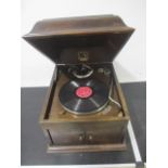 A HMV wind-up gramophone, in dome top wooden box, with HMV chrome needle dispenser & needle boxes