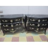 A pair of French bombe oramlu chest of drawers with marble tops