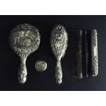 A collection of hallmarked silver dressing table ware including mirror, brushes etc.