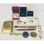 A collection of costume jewellery along with pens, silver pill boxes etc.