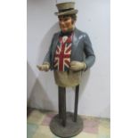 An early 20th century large John Bull painted wooden advertising figure, approx 176 cm height.