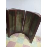 A pair of concave corner wall hanging shop display cabinets