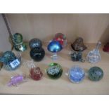 A collecvtion of glass paperweights including Mdina etc