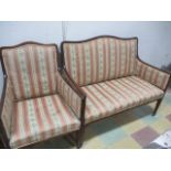 An Edwardian upholstered two seater sofa and matching chair