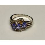 A 925 silver ring set with tanzanite and diamonds.