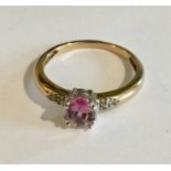 A 9ct gold pink topaz and diamond ring. Size P