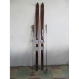 A pair of Witting vintage skis and poles