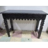 A Victorian consol table with pie crust detailing