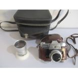 A Kodak Retina Reflex IV camera with Schneider- Kreuznach lens along with a similar 4/135mm lens