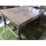 A large oak draw leaf table