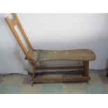 A vintage easel with built in seat