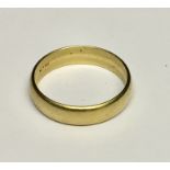 A wedding band marked 14k. Weight 3.9g