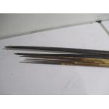 A tribal palm wood bow, possibly Papua New Guinea along with a smaller version etc.