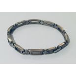 A titanium bracelet set with 5 diamonds