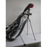 A set of Taylor Made golf clubs