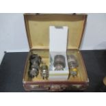 Four Mullard high power transmitting valves in leather case