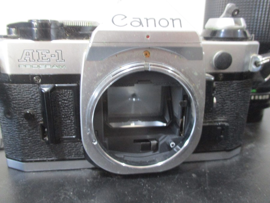 A Canon AE-1 camera with Canon and Pentax lenses - Image 4 of 11