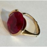 A 9ct gold ring with a large blood red stone