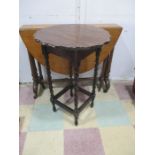 A Victorian oak Sutherland table along with an oak occasional table