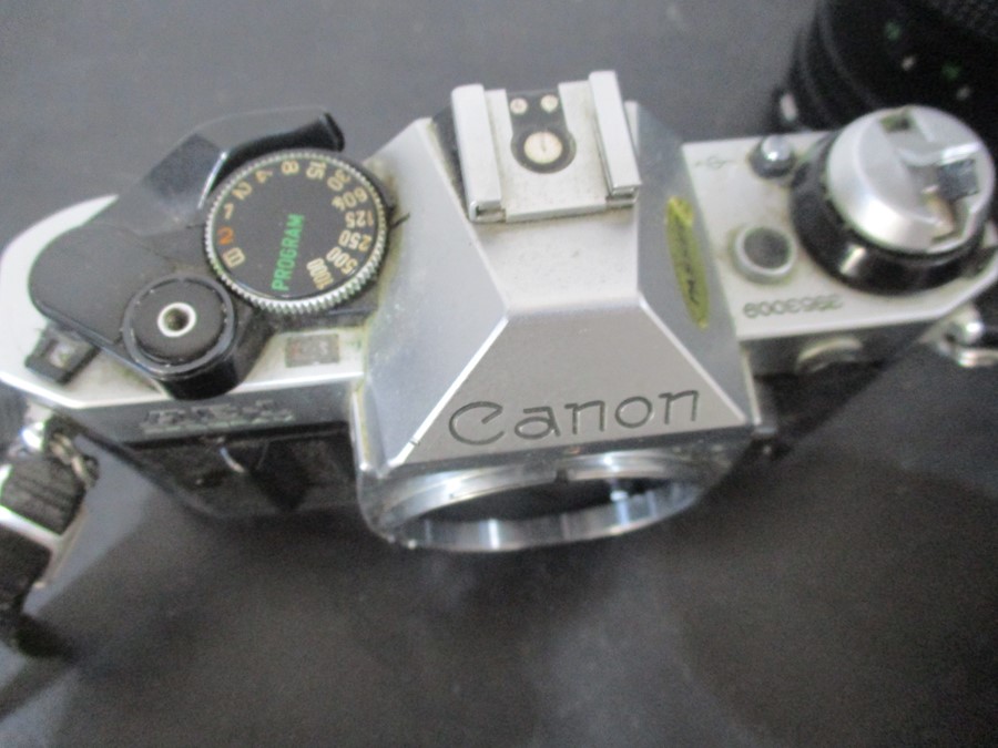 A Canon AE-1 camera with Canon and Pentax lenses - Image 5 of 11