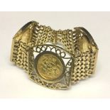 A 9ct gold bracelet set with three full sovereigns. Total weight 54.2g