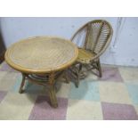 A vintage child's bamboo and rattan chair and table