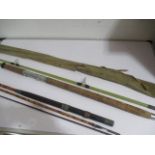 A three piece fly fishing rod along with one other rod