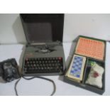 An Empire Aristocrat portable typewriter along with a vintage Lotto game and Ensign Full-Vue camera