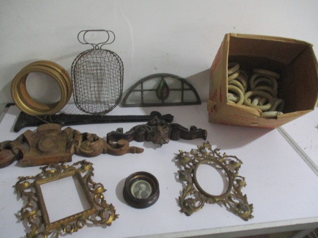 A collection of wooden curtain rings, hinges, basket, photo frames etc.