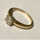 An illusion set 9ct gold diamond solitaire ring