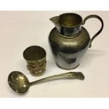 A Victorian hallmarked silver jug along with a sugar sifter etc.