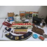 A collection of miscellaneous items including binoculars, masonic sash, knives, Guinness beer mat