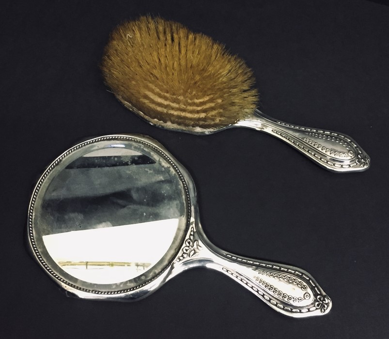 A hallmarked silver mirror and brush along with a Georgian silver spoon. - Image 2 of 2