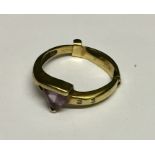 A 9ct gold ring set with amethyst and diamonds. 2.3g