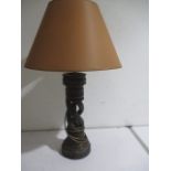 A wooden lamp with barley twist stem