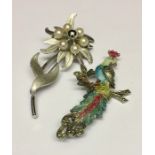 A sterling silver brooch along with one other.