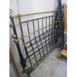 A double brass and iron bed