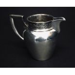 A continental 800 silver cream jug.