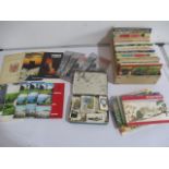A collection of various cigarette cards and Axminster tour guides