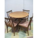 A mid century extending table and four G plan chairs