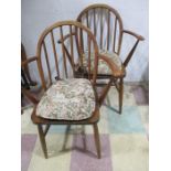 A pair of Ercol carvers
