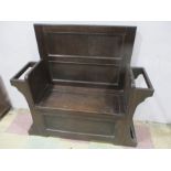 An oak hall seat with lift up seat
