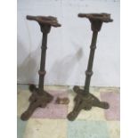 A pair of cast iron bases on tripod legs ( 1 A/F)