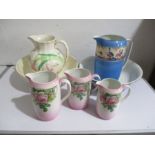 Two jug and bowl sets along with a graduated set of three jugs