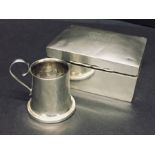 A hallmarked silver cigarette box and miniature tankard.