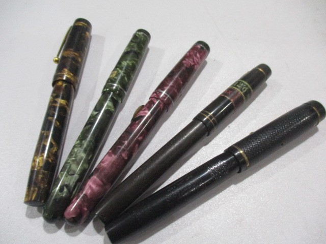 A collection of five fountain pens including Cadet, Mentmore etc