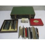 A collection of fountain pens, propelling pencils, ball point pens etc in case